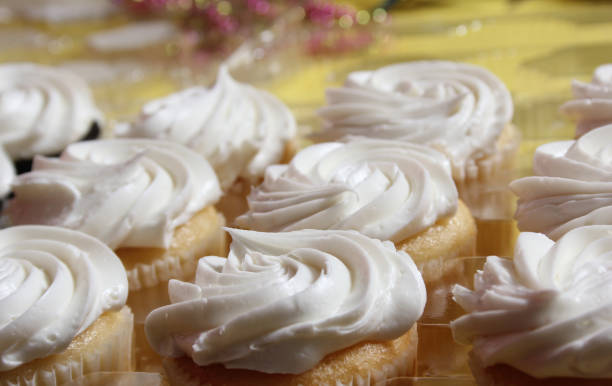istock Cupcakes With White Icing on Table at Party or Event 1488472125