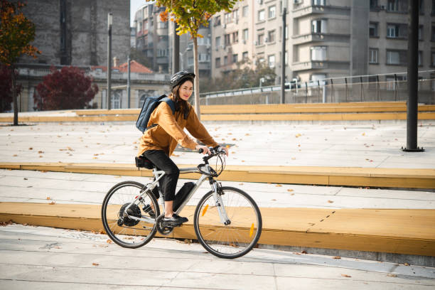istock Japanese woman cycling to work 1488476811