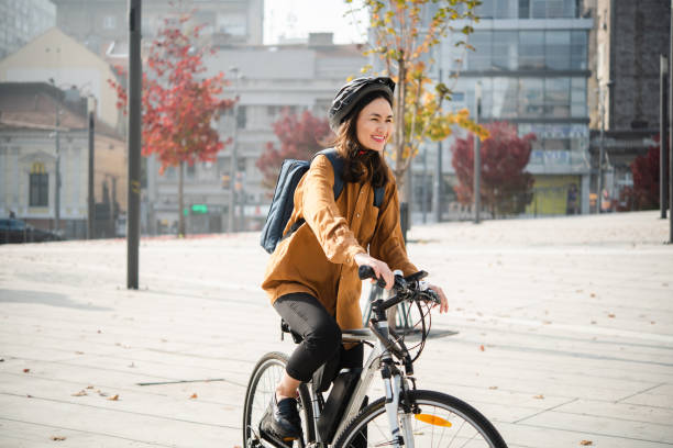 istock Japanese woman cycling to work 1488476819