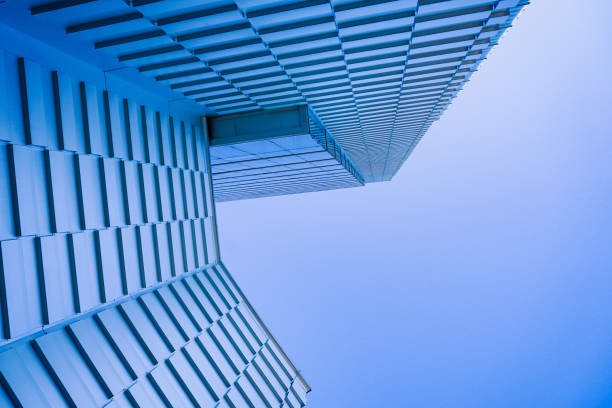 Low angle view of modern building against clear blue sky