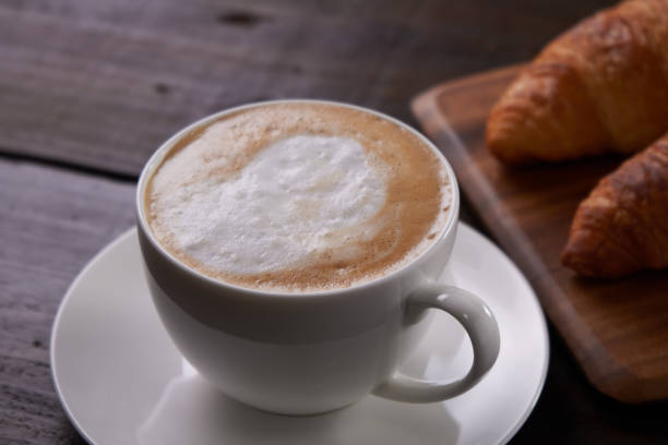 istock Cafe au lait with a wooden background 1488487017