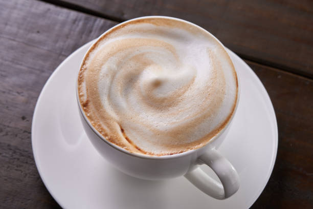 istock Cafe au lait with a wooden background 1488487019