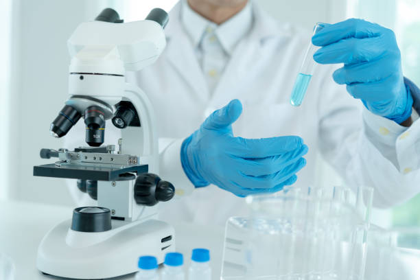 istock Scientist analyze biochemical samples in advanced scientific laboratory. Medical are mixing chemicals to test physical properties of cosmetic. develop viral. Biotechnology research in science lab. 1488489606