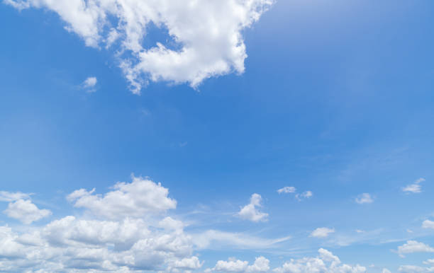 istock Panoramic view of clear blue sky and clouds, Blue sky background with tiny clouds. White fluffy clouds in the blue sky. 1488489659