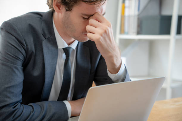 istock Young businessmen are tired and stressed from working by computer. Man has headache, eye strain, blurry vision, Migraine,office syndrome problem. 1488490130