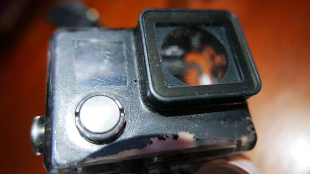 istock Action cam accessories: an old action camera case on the table. Camera case, close-up shot, top view 1488490957