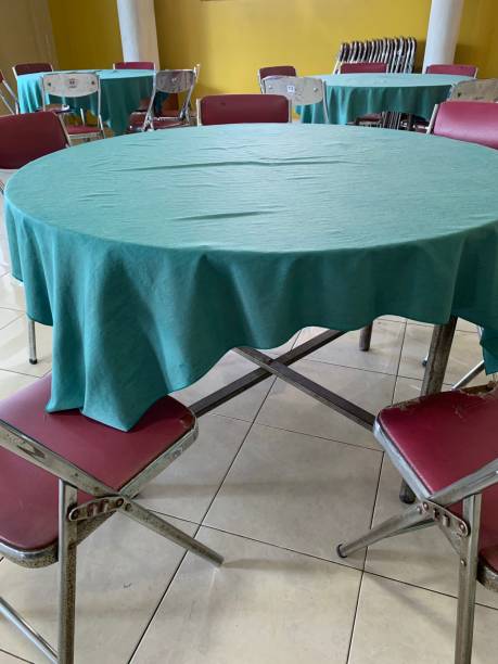 istock Tables and chairs for communal dining at an event 1488491158