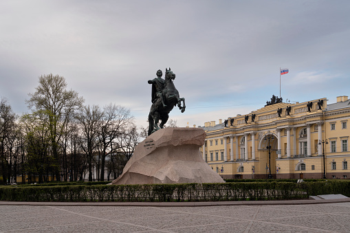 Monument to Peter on the Senate Square and the arch of the Senate and Synod building, St. Petersburg, Russia. The inscription on the monument To Peter the Great Catherine the Second 1782