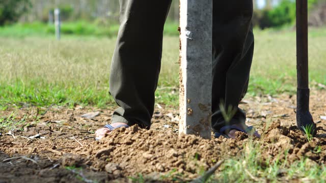 Dig a hole to bury the main fence.