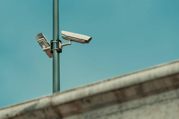 istock Security cameras for video surveillance behind the concrete wall 1488501762