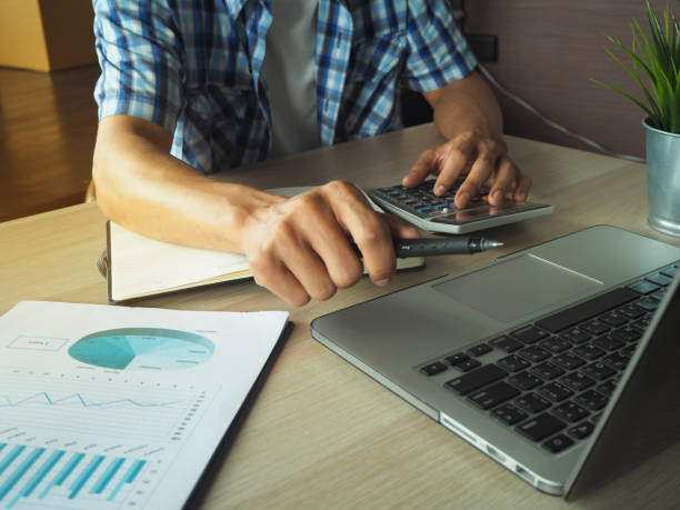 istock Business men calculate benefit, spreadsheets, graph financial development, bank accounts, statistics, economy, data analysis, investment analysis, stock exchange,Interest rates, income 1488505181