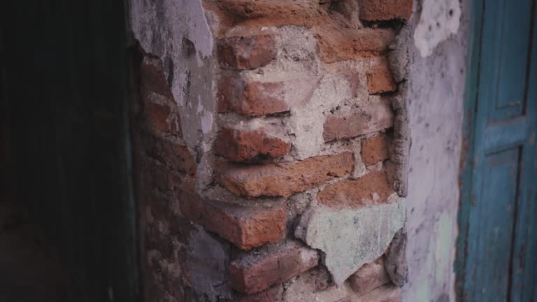 Brick damaged old wall of a building