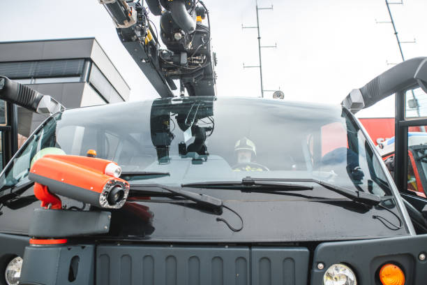 istock Senior Caucasian Firefighter Driving A Firetruck 1488506998