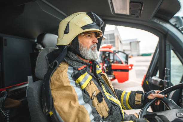 istock Senior Caucasian Firefighter Sitting In A Firetruck 1488507009