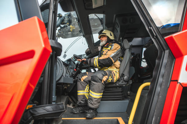 istock Senior Caucasian Firefighter Sitting In A Firetruck 1488507014
