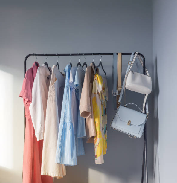 istock light colored womens summer clothes and shoes on  hanger 1488507572