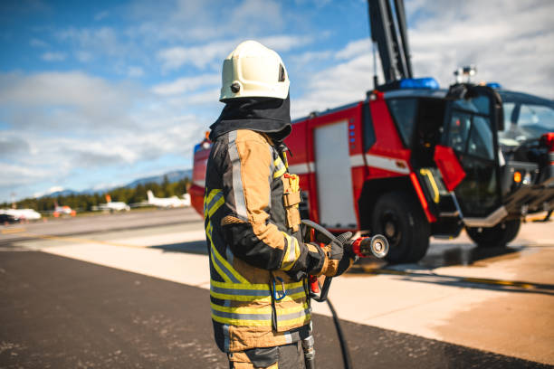 istock Fireman Pulling A Hose Out Of A Firetruck 1488507640