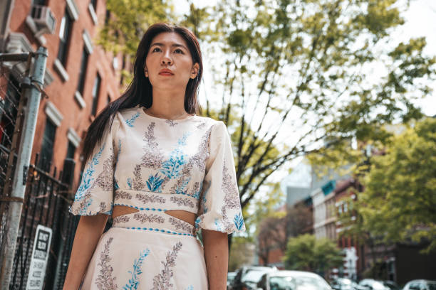 istock Young woman walking in Harlem New York 1488514650