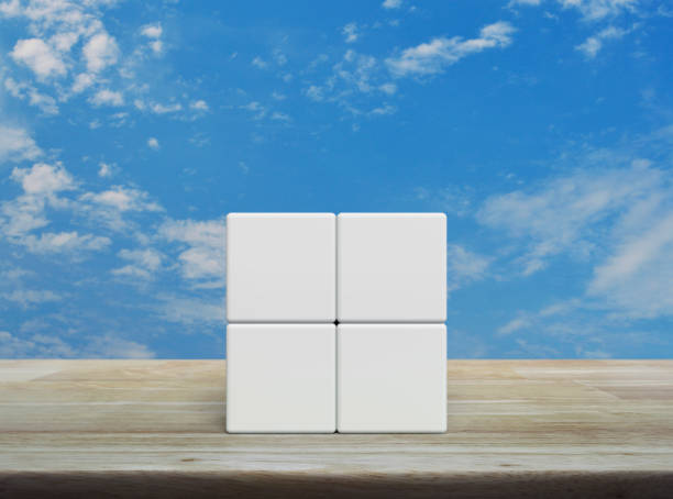 istock Four white block cubes on wooden table 1488515671