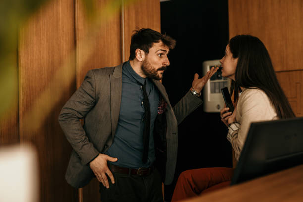 istock Angry manager discussing with a female worker in the office. 1488518354