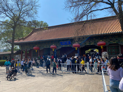Taiyuan, Shanxi, China- April 30, 2023: Jinci Temple (Jin Ancestral Temple), built to commemorate Tang Shuyu, the founder of Jin State (1033 B.C. - 376 B.C.) and his mother, is a combination of ancestral temple sacrificial architecture and natural landscape. There are many valuable architectures, murals, sculptures that have been existing for hundreds of years. Here is the entrance to Jinci.