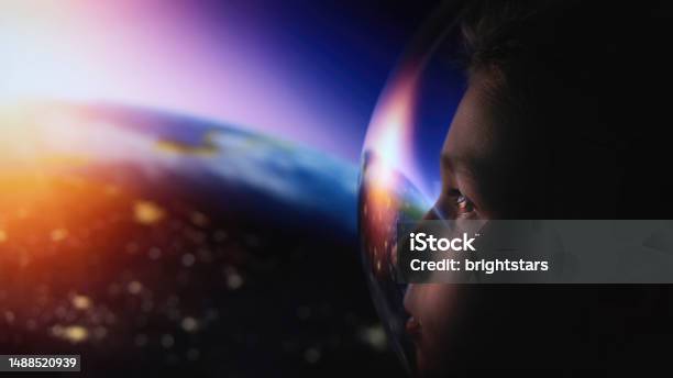 Boy In Space Stock Photo - Download Image Now - Astronaut, Planet Earth, Sunrise - Dawn