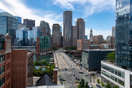 Boston, MA, USA-September 2022; High level view of the Seaport Boulevard over the Evelyn Moakley Bridge crossing Fort Point Channel in the direction of downtown Boston with high rise buildings