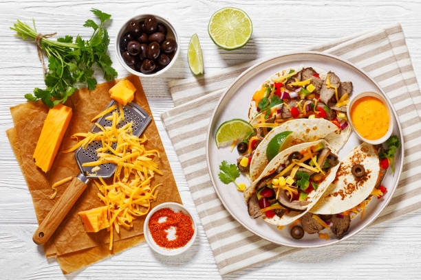istock Beef Steak Tacos with veggies, avocado, corn 1488525131