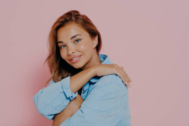istock Charming lady with beautiful smile on pink background 1488525132