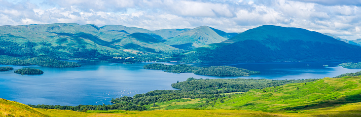 Panoramic view from Conic Hill and the West Highland Way over Loch Lomond and the mountains beyond, Scotland, UK.