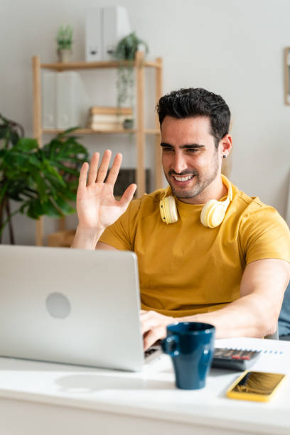 istock Man on a video call with laptop from home. 1488530369