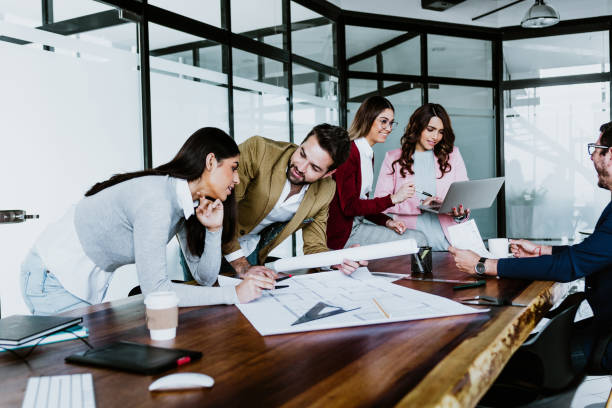 istock young latin people of architects or Designer teamwork planning and working on interior design project or architecture development in a creative office in Mexico Latin America, hispanic people 1488530398