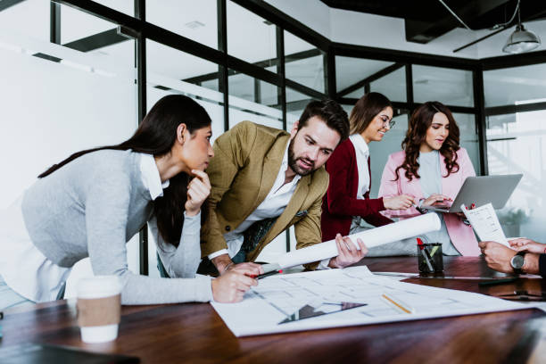 istock young latin people of architects or Designer teamwork planning and working on interior design project or architecture development in a creative office in Mexico Latin America, hispanic people 1488530426