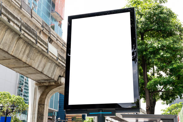 istock Outdoor pole LED display billboard with mock up white screen on footpath. clipping path for mockup 1488530439