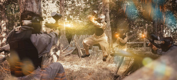 istock Paintball team rushing enemy positions on battleground 1488532658