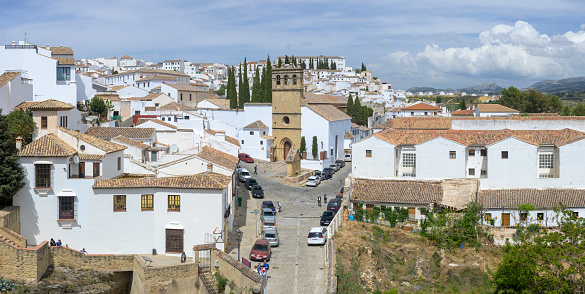 Ronda, Spain, April 2023: View on the whitewashed houses of Ronda in Andalusia and Padre Jesus church