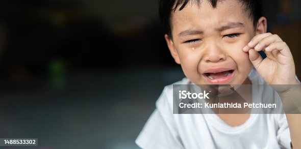 istock Portrait of a crying baby Asian boy.  Crying sad children concept. 1488533302