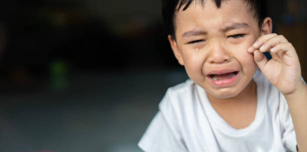 Portrait of a crying baby Asian boy. Crying sad children concept. Portrait of a crying baby Asian boy. Sad offended little boy. Crying sad children concept. child sadness stock pictures, royalty-free photos & images
