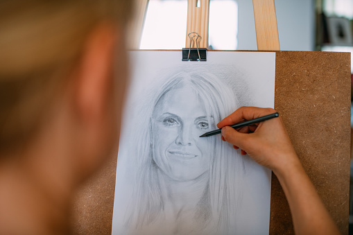 Painter Draws Woman Self-Portrait