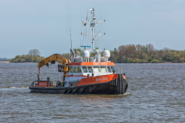 Stade, Germany – May 1, 2023: Tug BALOE on Elbe river . The workboat is owned and operated by dutch company Herman Sr BV at Zwijndrecht.