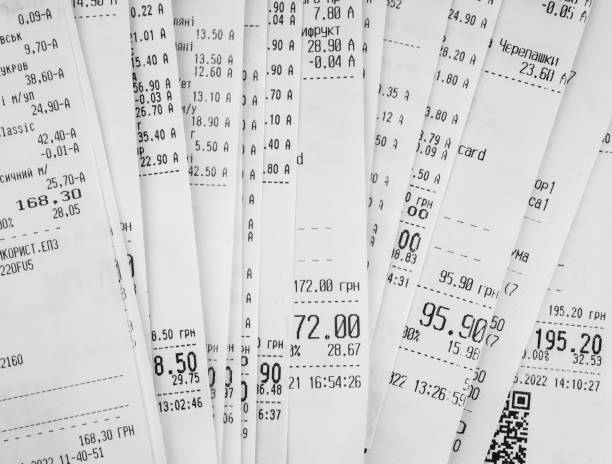 istock Pile of shopping receipts on white background 1488536196