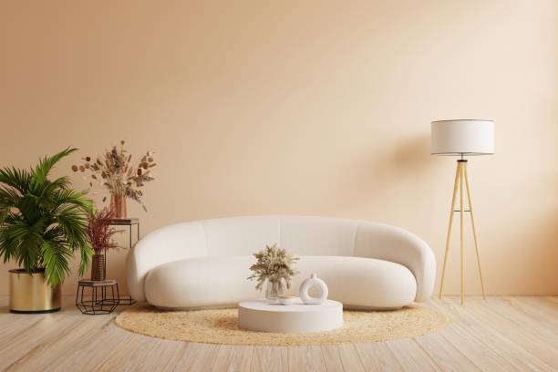 istock Interior wall mockup with sofa and decor on cream color wall. 1488536289