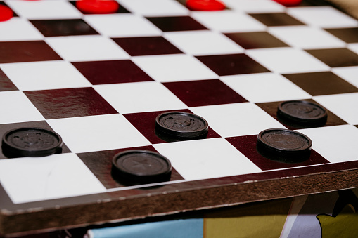 Chess board with Checkers placed on top