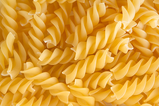 Pasta in the form of a spiral, backdrop.