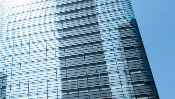 istock Close-Up modern glass building architecture on the blue sky background.copy space for layout. 1488539645