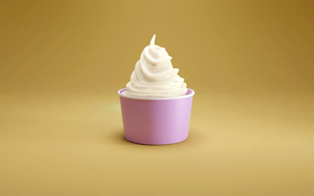 黄色いスタジオの床にピンクのカップに入ったシングルソフトクリーム。