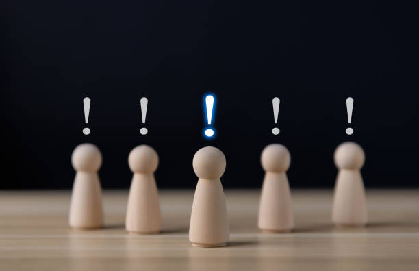 istock Block people showing a white exclamation mark. 1488542244
