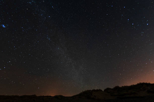 Dark starry sky over remote Welsh countryside stock photo
