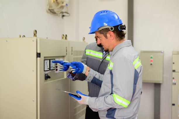 istock Professional engineers maintaining solar panels on solar cell farm 1488548241