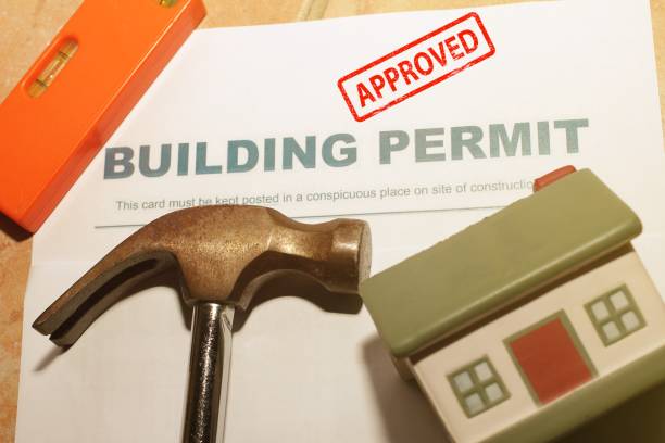 Building Permit concept with approved text on a residential home .